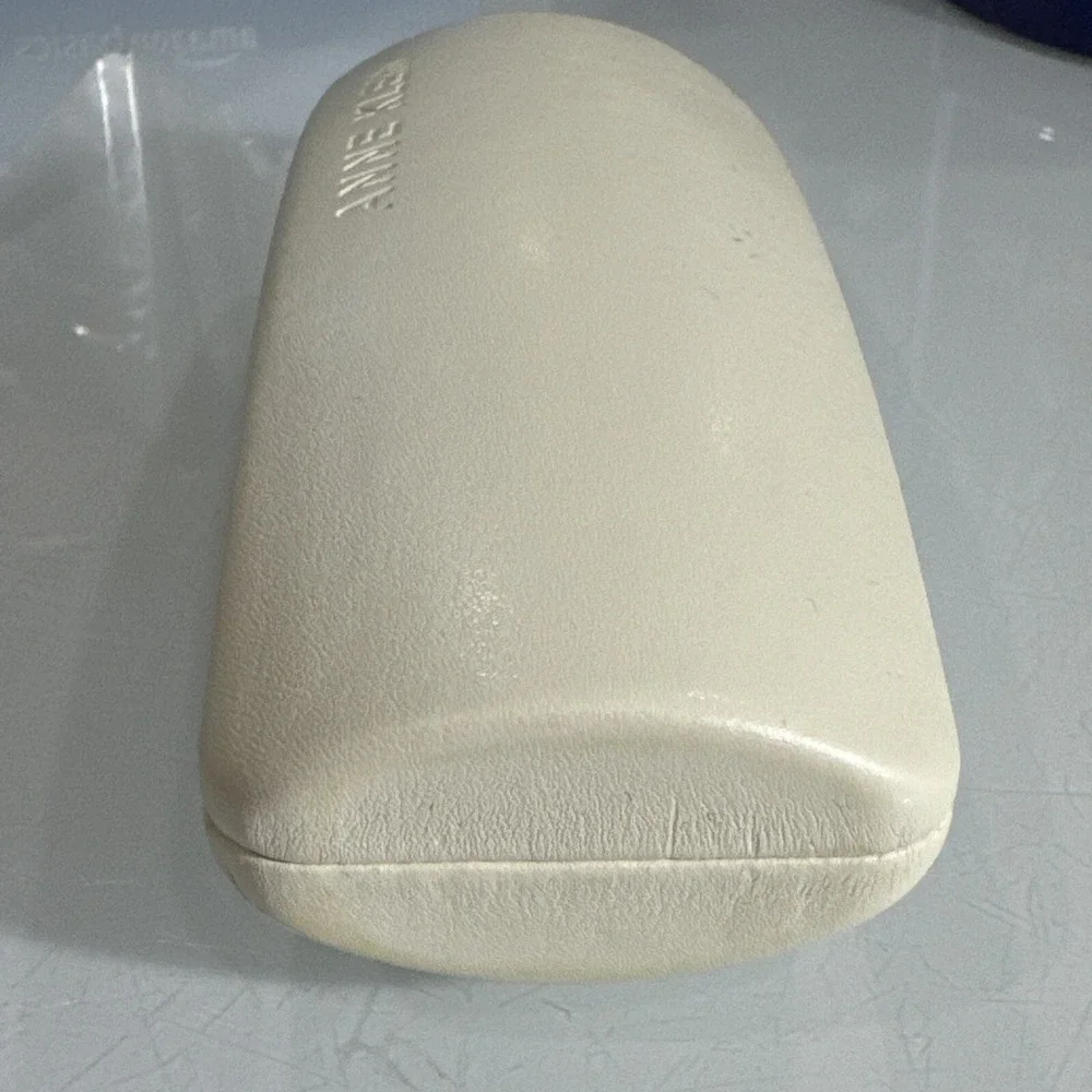 Anne Klein off white hard eyeglass clamshell case with logo